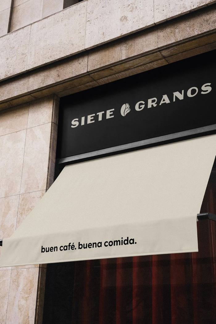 Fachada Siete Granos con toldo beige